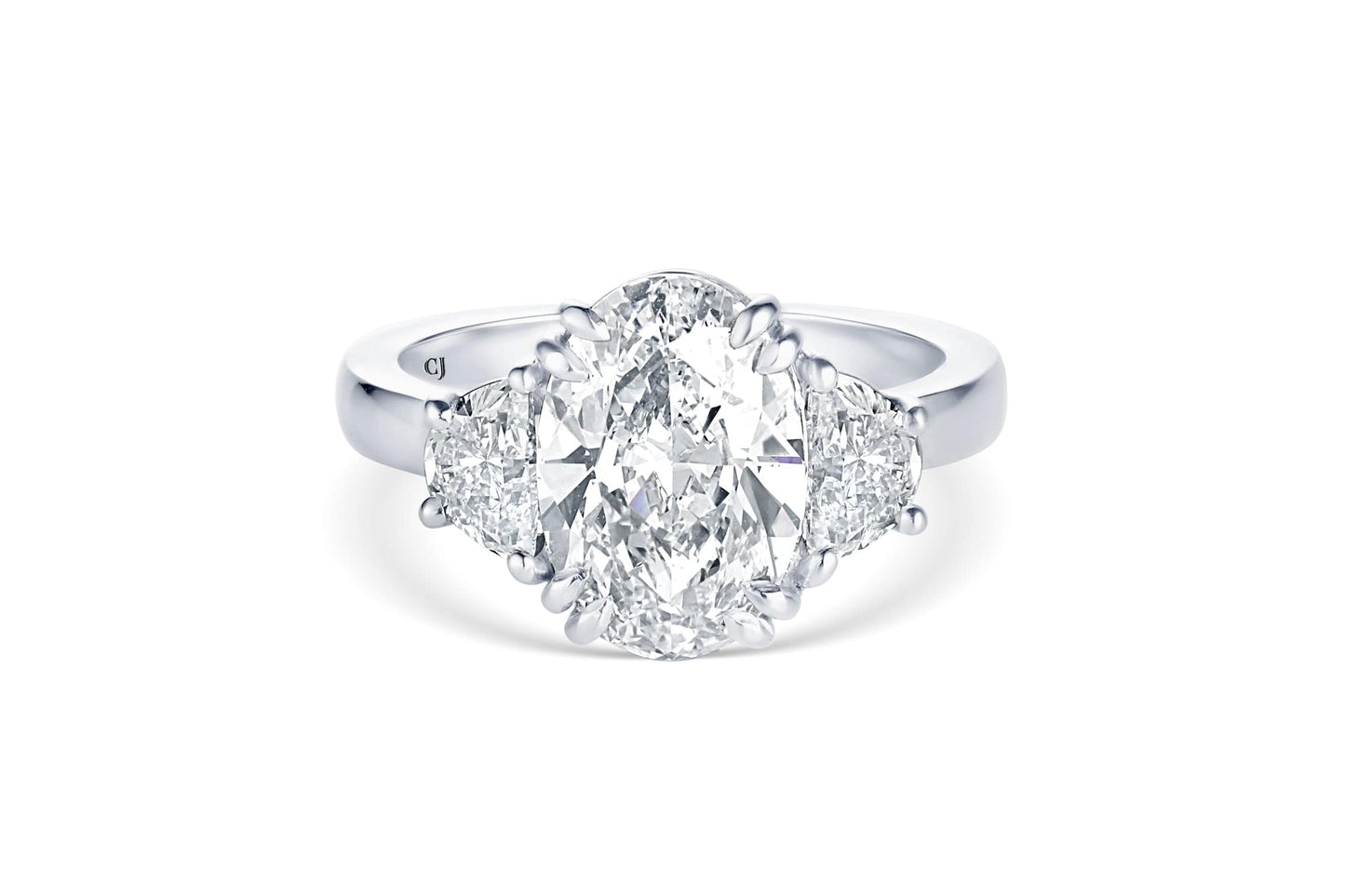 RIVIÈRE PLATINUM THREE-STONE OVAL DIAMOND RING