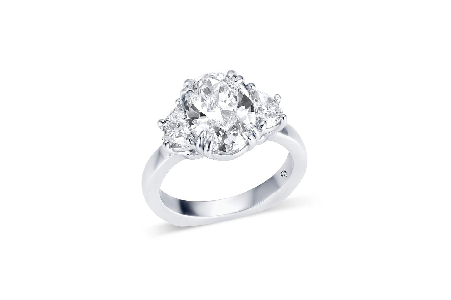 RIVIÈRE PLATINUM THREE-STONE OVAL DIAMOND RING